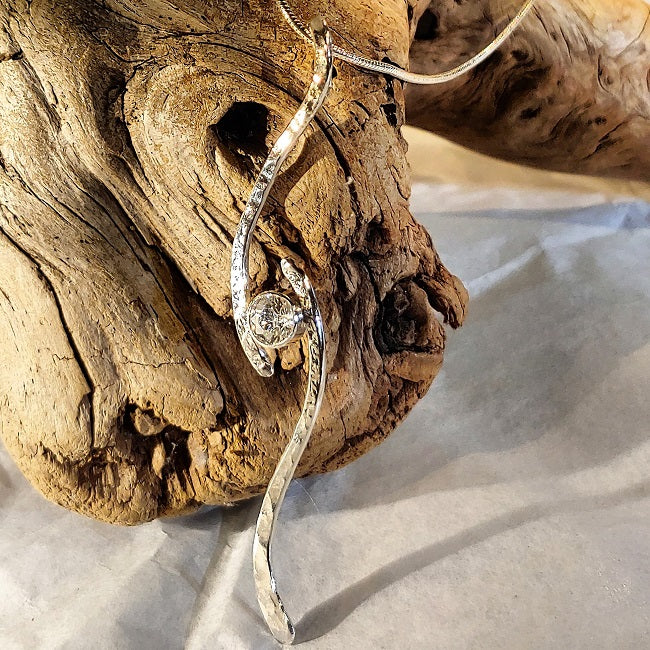 Hammered silver pendant with CZ